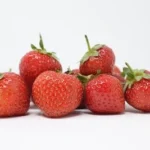 bunch of strawberries in white surface
