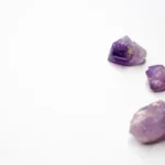 purple and brown stones on white surface