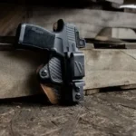 a gun on a wood surface