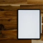 white rectangular frame on brown wooden table