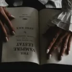 a woman's hands holding an open book