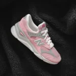pink,grey,and white New Balance sneaker