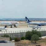 a couple of airplanes that are on a runway