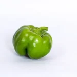green bell pepper on white surface