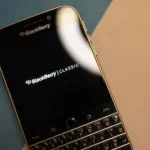 black and silver blackberry qwerty phone