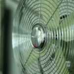 gray and black fan turned on in close up photography
