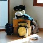 black and blue backpack on brown wooden table