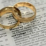 two gold-colored rings on paper