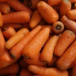 orange carrots on black surface
