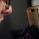 woman in black shirt holding microphone