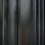 A metal criss-cross grid in undulating layers