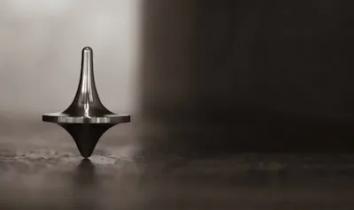 Decoding the Symbols in Spinning Tops Dreams: Balance & Playfulness