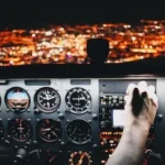 person holding airplane control panel