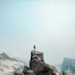 a person standing on top of a mountain