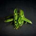 green peas on black surface