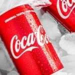 coca cola can on white plastic pack