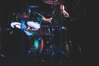 Unveiling the Symbolism of Playing Drums at a Concert in Dreams