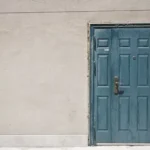 closed door and white painted wall