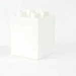 a white box with four white candles in it