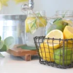 green lemon fruit in black metal basket