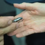 person holding silver nail cutter