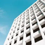 low angle photography of white building under blue sky