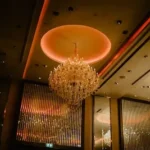 a chandelier hanging from the ceiling of a restaurant