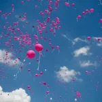 pink balloon lot on air during daytime