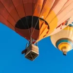 two hot air balloons in the sky during daytime