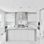 white wooden kitchen cabinet with mirror
