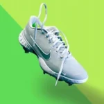 white nike athletic shoe on green textile