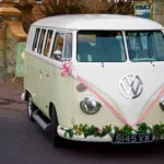 white Volkswagen bus parked on road
