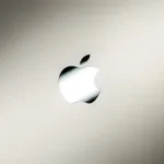 an apple logo on a silver background