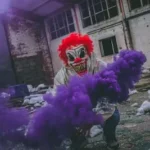 clown holding purple smoke bomb in ruined building