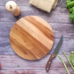brown wooden chopping board beside green vegetable