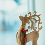 brown wooden carved reindeer decoration on table