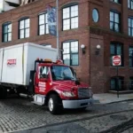 red cargo truck on road during daytime