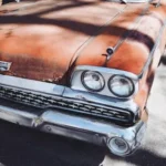 vintage orange car during daytime