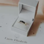 a white box with a ring inside of it