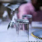 clear flute and highball glasses upside down on table